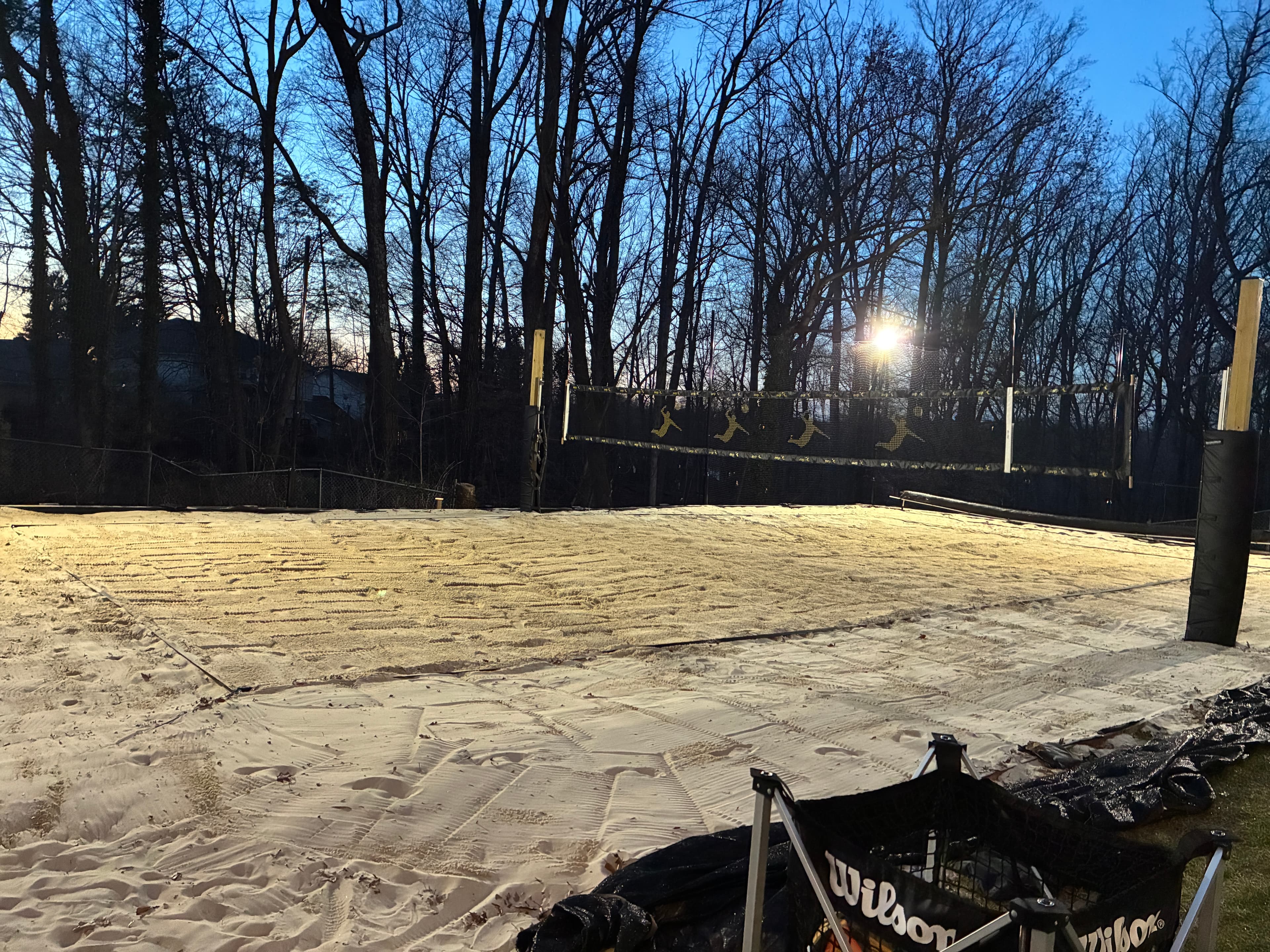 Sand volleyball court lit up at night