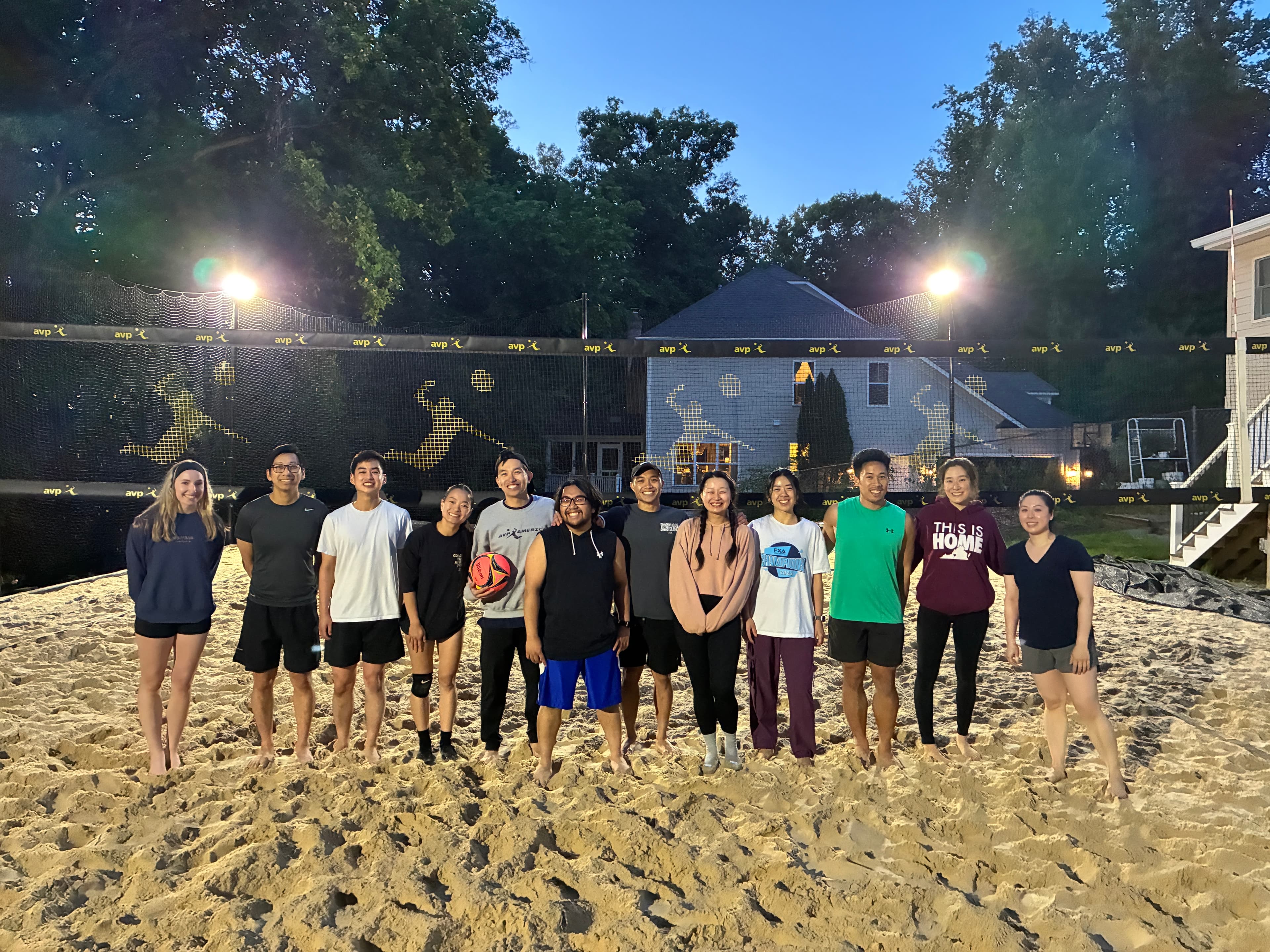 Players gathered on the sand court during the first beginner class